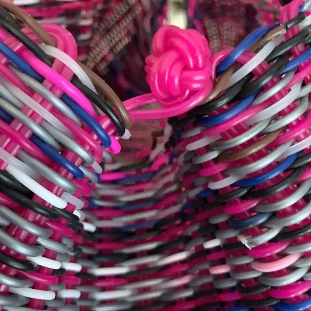 Handwoven plastic bag in multicolor with pink bottom and pink handles